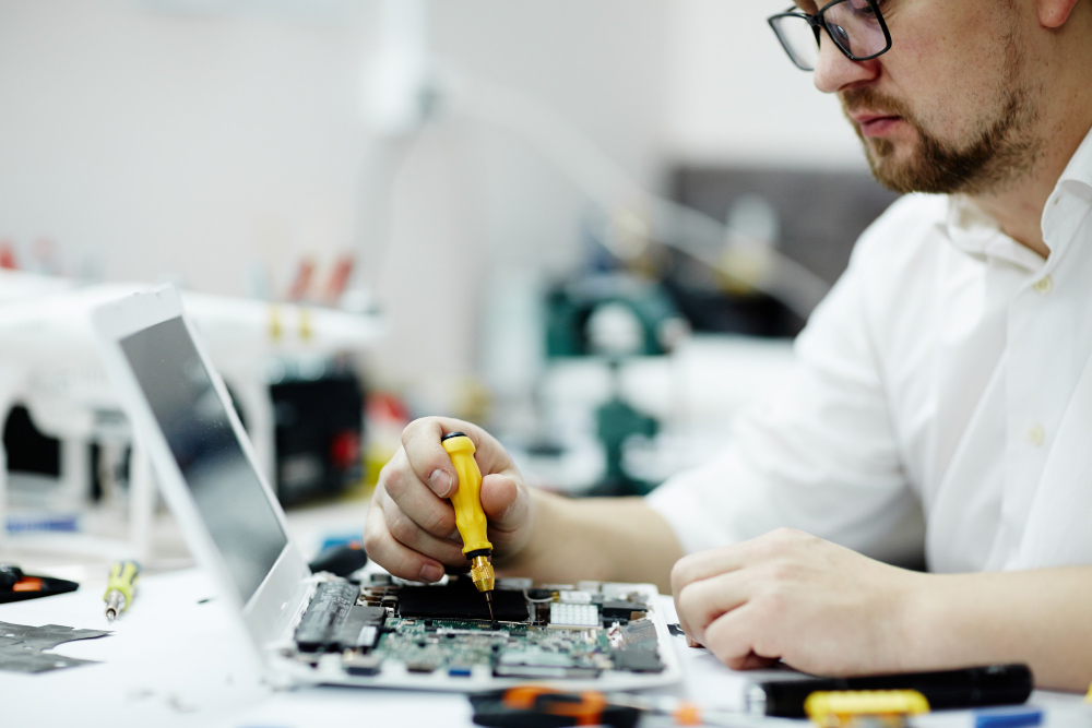Technician working on a laptop